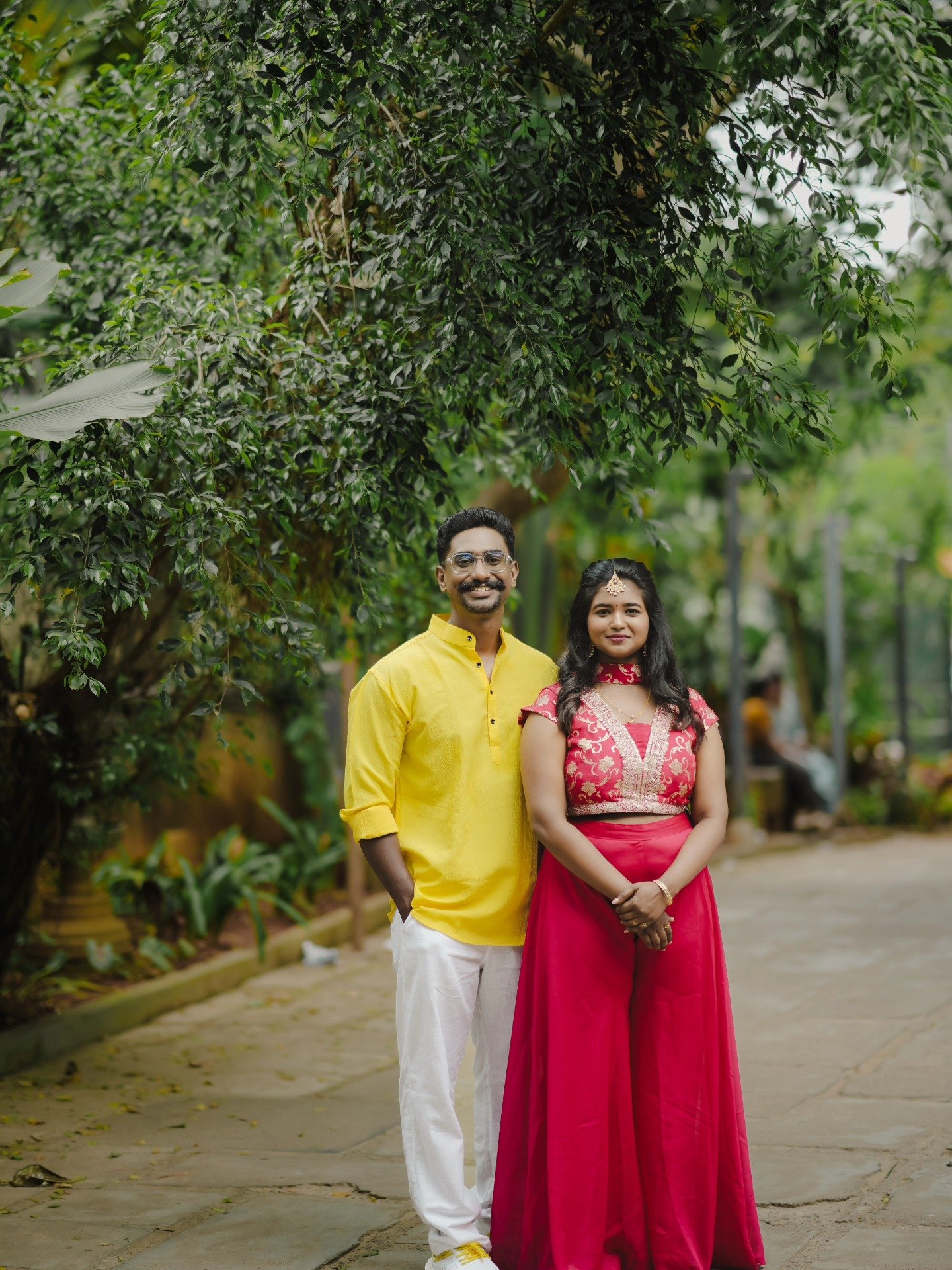 A bride and groom walking hand in hand in their wedding attire